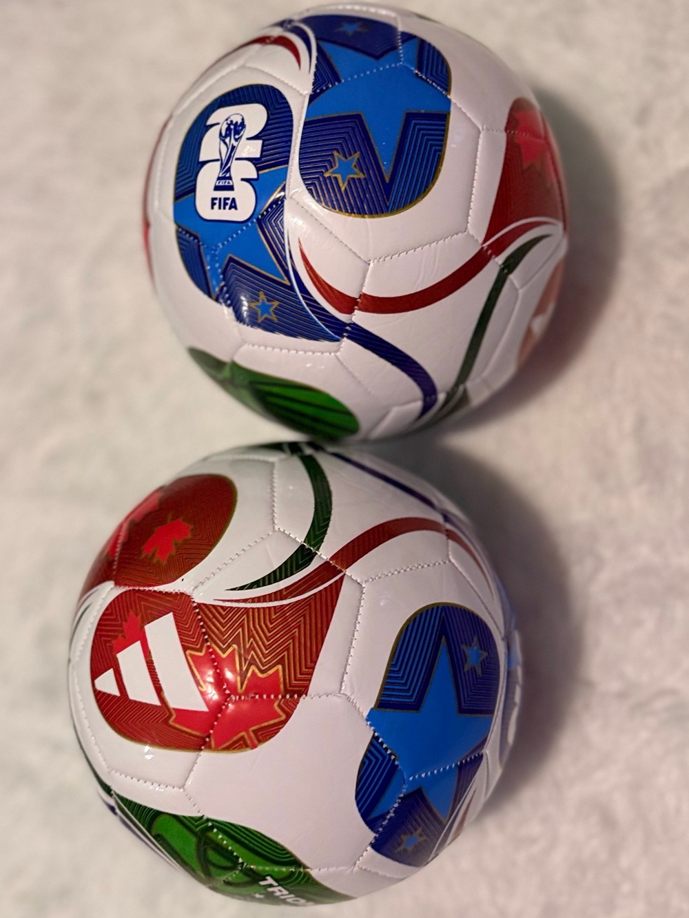 adidas White Soccer Ball with Blue, Red & Green Star Graphics
